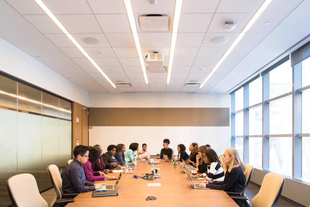 women in conference room - women's history month cyber security resources for women
