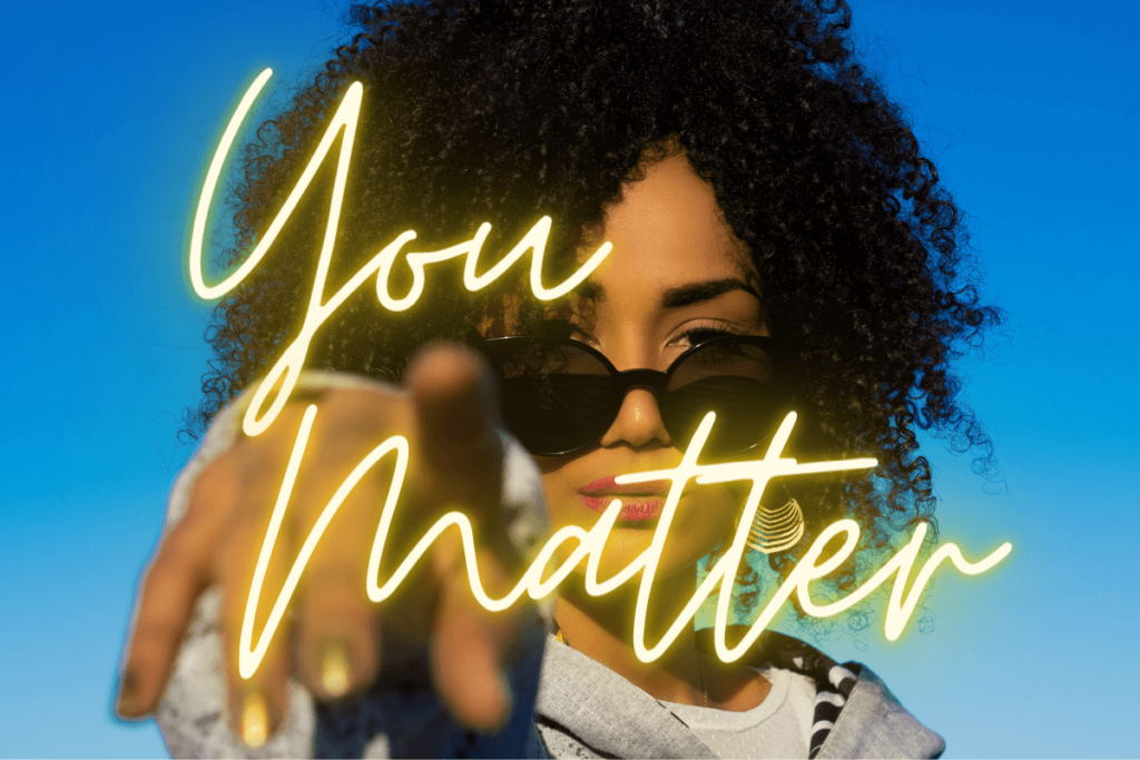 Woman pointing with blue background and neon you matter text on top of image_cybersecurity awareness month_cyber security resources for women